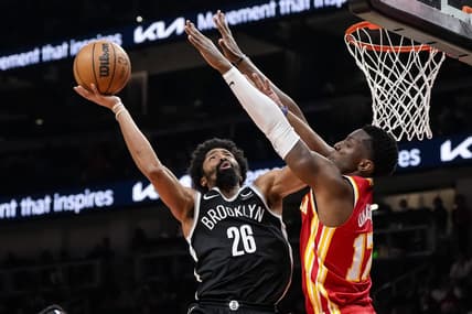 Dec 6, 2023; Atlanta, Georgia, USA; Brooklyn Nets guard Spencer Dinwiddie (26) shoots defended by Atlanta Hawks forward Onyeka Okongwu (17) during the second half at State Farm Arena. Mandatory Credit: Dale Zanine-USA TODAY Sports