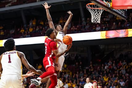Dec 6, 2023; Minneapolis, Minnesota, USA; Nebraska Cornhuskers guard Jamarques Lawrence (10) drives to the basket as Minnesota Golden Gophers forward Pharrel Payne (21) defends during the second half at Williams Arena. Mandatory Credit: Matt Krohn-USA TODAY Sports