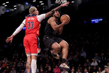 Dec 8, 2023; Brooklyn, New York, USA; Brooklyn Nets guard Cam Thomas (24) drives to the basket against Washington Wizards forward Kyle Kuzma (33) during the first quarter at Barclays Center. Mandatory Credit: Brad Penner-USA TODAY Sports