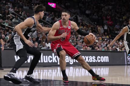 Dec 8, 2023; San Antonio, Texas, USA;  Chicago Bulls center Nikola Vucevic (9) moves against San Antonio Spurs forward Zach Collins (23) in the first half at the Frost Bank Center. Mandatory Credit: Daniel Dunn-USA TODAY Sports