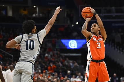 Dec 9, 2023; Washington, District of Columbia, USA; Syracuse Orange guard Judah Mintz (3) shoots over Georgetown Hoyas guard Jayden Epps (10) during the first half at Capital One Arena. Mandatory Credit: Brad Mills-USA TODAY Sports