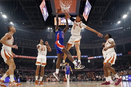 Dec 9, 2023; Austin, Texas, USA; Texas Longhorns forward Kadin Shedrick (5) blocks the shot attempted by Houston Christian Huskies forward Michael Imariagbe (33) during the first half at Moody Center. Mandatory Credit: Scott Wachter-USA TODAY Sports