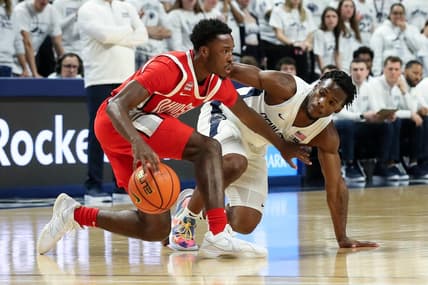 Dec 9, 2023; University Park, Pennsylvania, USA; Ohio State Buckeyes guard Dale Bonner (4) dribbles the ball as Penn State Nittany Lions guard Kanye Clary (0) defends during the first half at Bryce Jordan Center. Mandatory Credit: Matthew O'Haren-USA TODAY Sports