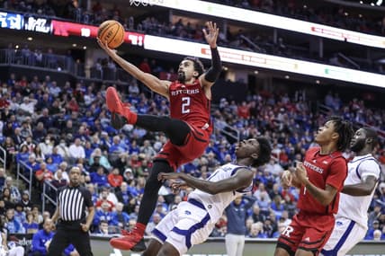 Dec 9, 2023; Newark, New Jersey, USA; Rutgers Scarlet Knights guard Noah Fernandes (2) drives past Seton Hall Pirates guard Kadary Richmond (1) for a layup in the first half at Prudential Center. Mandatory Credit: Wendell Cruz-USA TODAY Sports