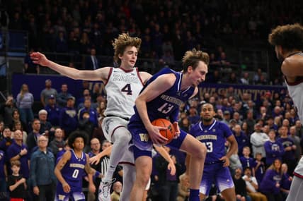 Dec 9, 2023; Seattle, Washington, USA; Washington Huskies forward Moses Wood (13) rebounds the ball in front of Gonzaga Bulldogs guard Dusty Stromer (4) during the second half at Alaska Airlines Arena at Hec Edmundson Pavilion. Mandatory Credit: Steven Bisig-USA TODAY Sports