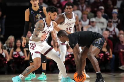 Dec 10, 2023; College Station, Texas, USA; Memphis Tigers forward David Jones (8) handles the ball against Texas A&M Aggies guard Jace Carter (0) during the first half at Reed Arena. Mandatory Credit: Erik Williams-USA TODAY Sports