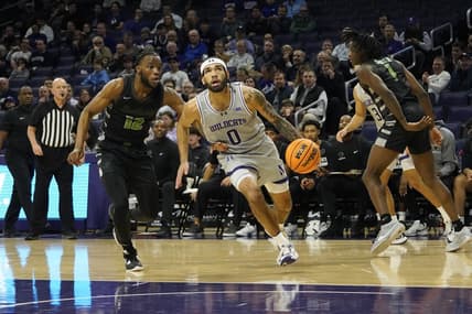 Dec 13, 2023; Evanston, Illinois, USA; Chicago State Cougars guard Brent Davis (12) defends Northwestern Wildcats guard Boo Buie (0) during the first half at Welsh-Ryan Arena. Mandatory Credit: David Banks-USA TODAY Sports