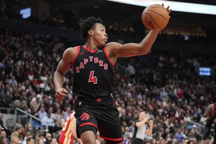 Dec 15, 2023; Toronto, Ontario, CAN; Toronto Raptors forward Scottie Barnes (4) grabs a rebound against the Atlanta Hawks during the first half at Scotiabank Arena. Mandatory Credit: John E. Sokolowski-USA TODAY Sports