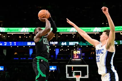 Dec 15, 2023; Boston, Massachusetts, USA; Boston Celtics guard Jaylen Brown (7) shoots the ball over Orlando Magic forward Franz Wagner (22) during the second half at TD Garden. Mandatory Credit: Eric Canha-USA TODAY Sports