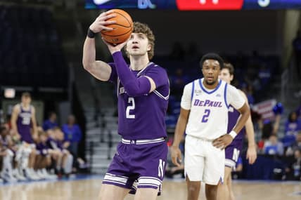 Dec 16, 2023; Chicago, Illinois, USA; Northwestern Wildcats forward Nick Martinelli (2) shoots a free throw against the DePaul Blue Demons during the first half at Wintrust Arena. Mandatory Credit: Kamil Krzaczynski-USA TODAY Sports