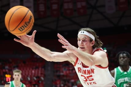 Dec 16, 2023; Salt Lake City, Utah, USA; Utah Utes center Branden Carlson (35) reaches for a rebound against the Utah Valley Wolverines during the second half at Jon M. Huntsman Center. Mandatory Credit: Rob Gray-USA TODAY Sports