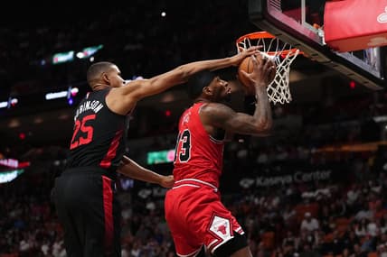 Dec 16, 2023; Miami, Florida, USA; Miami Heat center Orlando Robinson (25) fouls Chicago Bulls forward Torrey Craig (13) during the first half at Kaseya Center. Mandatory Credit: Jasen Vinlove-USA TODAY Sports
