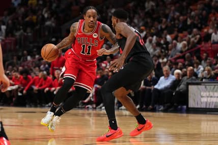 Dec 16, 2023; Miami, Florida, USA; Chicago Bulls forward DeMar DeRozan (11) drives the ball around Miami Heat forward Haywood Highsmith (24) during the first half at Kaseya Center. Mandatory Credit: Jasen Vinlove-USA TODAY Sports