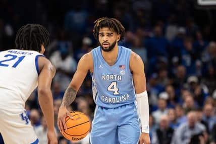 Dec 16, 2023; Atlanta, Georgia, USA North North Carolina Tar Heels guard RJ Davis (4) dribbles the ball against UCLA Bruins forward Evan Manjikian (21) during the second half at State Farm Arena. Mandatory Credit: Jordan Godfree-USA TODAY Sports