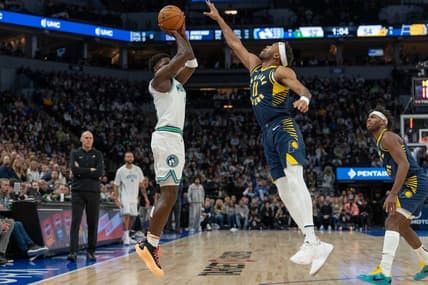 Dec 16, 2023; Minneapolis, Minnesota, USA; Minnesota Timberwolves guard Anthony Edwards (5) hits a three point basket defended by Indiana Pacers forward Bruce Brown (11) in the second quarter at Target Center. Mandatory Credit: Matt Blewett-USA TODAY Sports
