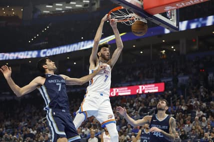 Dec 18, 2023; Oklahoma City, Oklahoma, USA; Oklahoma City Thunder forward Chet Holmgren (7) dunks against Memphis Grizzlies forward Santi Aldama (7) during the second quarter at Paycom Center. Mandatory Credit: Alonzo Adams-USA TODAY Sports
