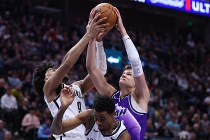 Dec 18, 2023; Salt Lake City, Utah, USA; Brooklyn Nets forward Trendon Watford (9) and Utah Jazz center Walker Kessler (24) battle for a rebound during the second quarter at Delta Center. Mandatory Credit: Rob Gray-USA TODAY Sports
