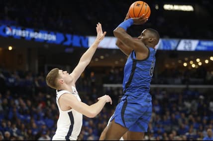 Dec 19, 2023; Memphis, Tennessee, USA; Memphis Tigers forward David Jones (8) shoots as Virginia Cavaliers guard Isaac McKneely (11) defends during the first half at FedExForum. Mandatory Credit: Petre Thomas-USA TODAY Sports