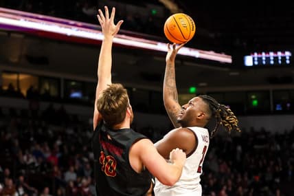 Dec 19, 2023; Columbia, South Carolina, USA; South Carolina Gamecocks forward B.J. Mack (2) shoots over Winthrop Eagles center Alex Timmerman (40) in the first half at Colonial Life Arena. Mandatory Credit: Jeff Blake-USA TODAY Sports