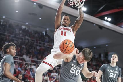 Dec 20, 2023; Queens, New York, USA; St. John's Red Storm center Joel Soriano (11) dunks over Xavier Musketeers forward Gytis Nemeiksa (50) in the second half at Carnesecca Arena. Mandatory Credit: Wendell Cruz-USA TODAY Sports
