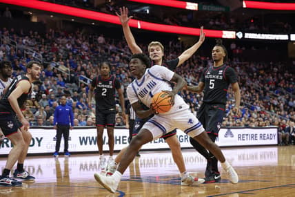 Dec 20, 2023; Newark, New Jersey, USA; Seton Hall Pirates guard Kadary Richmond (1) drives to the basket in front of Connecticut Huskies guard Cam Spencer (12) and guard Stephon Castle (5) during the second half at Prudential Center. Mandatory Credit: Vincent Carchietta-USA TODAY Sports