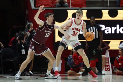 Dec 20, 2023; Salt Lake City, Utah, USA; Utah Utes center Lawson Lovering (34) posts up against Bellarmine Knights forward Langdon Hatton (12) during the first half at Jon M. Huntsman Center. Mandatory Credit: Rob Gray-USA TODAY Sports