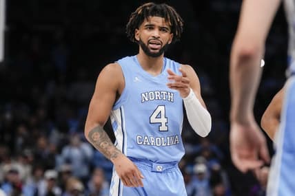 Dec 20, 2023; Charlotte, North Carolina, USA; North Carolina Tar Heels guard RJ Davis (4) talks to a teammate during a foul shot against the Oklahoma Sooners during the second half at Spectrum Center. Mandatory Credit: Jim Dedmon-USA TODAY Sports