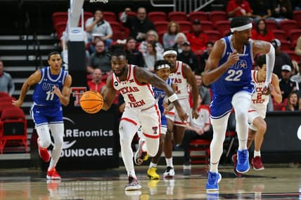 Dec 21, 2023; Lubbock, Texas, USA;  Texas Tech Red Raiders guard Joe Toussaint (6) brings the ball up court against Texas-Arlington Mavericks forward Shemar Wilson (22) and forward Dwayne Korma (11) in the first half at United Supermarkets Arena. Mandatory Credit: Michael C. Johnson-USA TODAY Sports