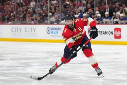 Dec 21, 2023; Sunrise, Florida, USA; Florida Panthers defenseman Aaron Ekblad (5) passes the puck against the St. Louis Blues during the second period at Amerant Bank Arena. Mandatory Credit: Jasen Vinlove-USA TODAY Sports