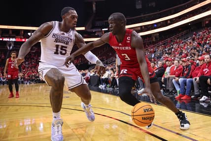Dec 23, 2023; Newark, NY, USA; Rutgers Scarlet Knights forward Mawot Mag (3) dribbles against Mississippi State Bulldogs forward Jimmy Bell Jr. (15) during the first half at Prudential Center. Mandatory Credit: Vincent Carchietta-USA TODAY Sports
