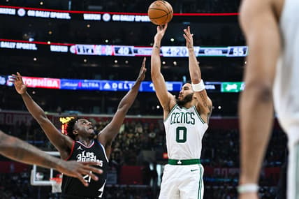 Dec 23, 2023; Los Angeles, California, USA; Boston Celtics forward Jayson Tatum (0) shoots against Los Angeles Clippers forward Kobe Brown (21) during the second quarter at Crypto.com Arena. Mandatory Credit: Jonathan Hui-USA TODAY Sports