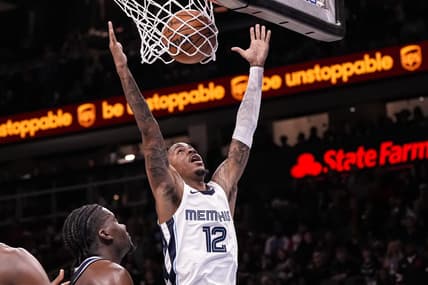 Dec 23, 2023; Atlanta, Georgia, USA; Memphis Grizzlies guard Ja Morant (12) dunks against the Atlanta Hawks during the second half  at State Farm Arena. Mandatory Credit: Dale Zanine-USA TODAY Sports