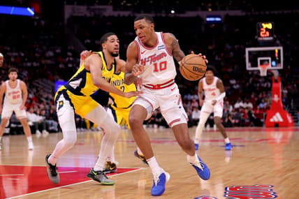 Dec 26, 2023; Houston, Texas, USA; Houston Rockets forward Jabari Smith Jr. (10) handles the ball against Indiana Pacers guard Tyrese Haliburton (0) during the first quarter at Toyota Center. Mandatory Credit: Erik Williams-USA TODAY Sports
