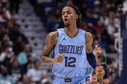 Dec 26, 2023; New Orleans, Louisiana, USA; Memphis Grizzlies guard Ja Morant (12) reacts to a made basket against the New Orleans Pelicans during the first half at Smoothie King Center. Mandatory Credit: Stephen Lew-USA TODAY Sports