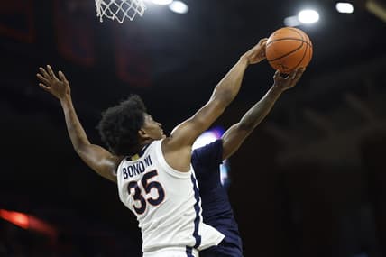 Dec 27, 2023; Charlottesville, Virginia, USA; Virginia Cavaliers guard Leon Bond III (35) blocks the shot of Morgan State Bears guard Rob Lawson (3) in the first half at John Paul Jones Arena. Mandatory Credit: Geoff Burke-USA TODAY Sports