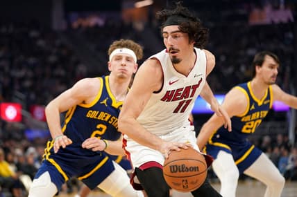 Dec 28, 2023; San Francisco, California, USA; Miami Heat forward Jaime Jaquez Jr. (11) spins towards the hoop next to Golden State Warriors guard Brandin Podziemski (2) in the first quarter at the Chase Center. Mandatory Credit: Cary Edmondson-USA TODAY Sports