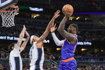 Dec 29, 2023; Orlando, Florida, USA; New York Knicks forward Julius Randle (30) shoots against Orlando Magic forward Paolo Banchero (5) during the first quarter at KIA Center. Mandatory Credit: Mike Watters-USA TODAY Sports