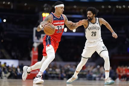 Dec 29, 2023; Washington, District of Columbia, USA; Washington Wizards forward Kyle Kuzma (33) dribbles the ball as Brooklyn Nets guard Spencer Dinwiddie (26) defends in the second quarter at Capital One Arena. Mandatory Credit: Geoff Burke-USA TODAY Sports