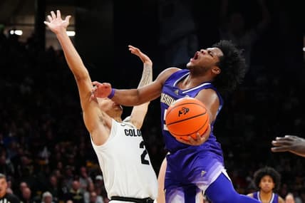 Dec 29, 2023; Boulder, Colorado, USA; Washington Huskies guard Sahvir Wheeler (5) shoots the ball at Colorado Buffaloes guard KJ Simpson (2) in the first half at the CU Events Center. Mandatory Credit: Ron Chenoy-USA TODAY Sports