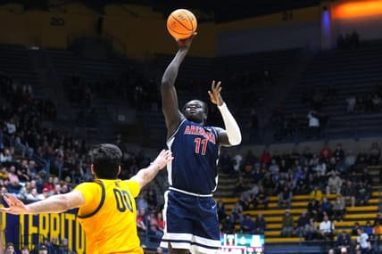 Dec 29, 2023; Berkeley, California, USA; Arizona Wildcats center Oumar Ballo (11) shoots against California Golden Bears forward Fardaws Aimaq (00) during the first half at Haas Pavilion. Mandatory Credit: Darren Yamashita-USA TODAY Sports