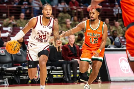 Dec 30, 2023; Columbia, South Carolina, USA; South Carolina Gamecocks guard Ta'Lon Cooper (55) drives around Florida A&M Rattlers guard K'Jei Parker (12) in the first quarter at Colonial Life Arena. Mandatory Credit: Jeff Blake-USA TODAY Sports