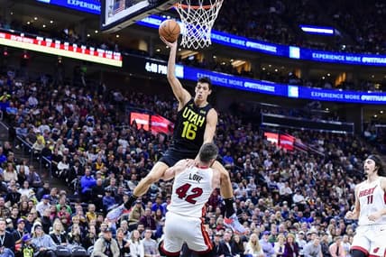 Dec 31, 2022; Salt Lake City, Utah, USA; Utah Jazz forward Simone Fontecchio (16) gets fouled by Miami Heat forward/center Kevin Love (42) during the second half at Vivint Arena. Mandatory Credit: Christopher Creveling-USA TODAY Sports