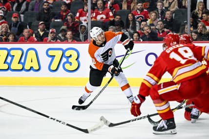 Dec 31, 2023; Calgary, Alberta, CAN; Philadelphia Flyers right wing Bobby Brink (10) takes a shot against the Calgary Flames during the second period at Scotiabank Saddledome. Mandatory Credit: Brett Holmes-USA TODAY Sports