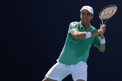 Mar 28, 2022; Miami Gardens, FL, USA; Roberto Bautista Agut (ESP) hits a forehand against Jenson Brooksby (USA)(not pictured) in a third round men's singles match in the Miami Open at Hard Rock Stadium. Mandatory Credit: Geoff Burke-USA TODAY Sports