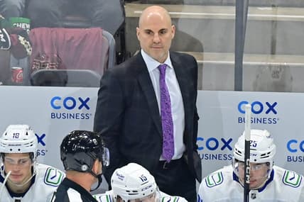 Apr 13, 2023; Tempe, Arizona, USA;  Vancouver Canuck head coach Rick Tocchet watches game action in the first period against the Arizona Coyotes at Mullett Arena. Mandatory Credit: Matt Kartozian-USA TODAY Sports