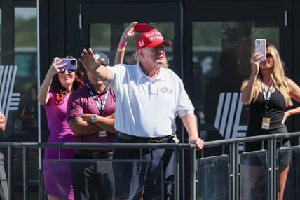 Aug 13, 2023; Bedminster, New Jersey, USA; Former President Donald Trump waves to the fans during the final round of the LIV Golf Bedminster golf tournament at Trump National Bedminster. Mandatory Credit: Vincent Carchietta-USA TODAY Sports