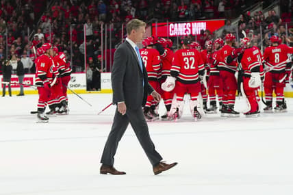 Oct 26, 2023; Raleigh, North Carolina, USA; Seattle Kraken head coach Dave Hakstol walks off the ice as the Carolina Hurricanes celebrate there victory win the over time at PNC Arena. Mandatory Credit: James Guillory-USA TODAY Sports