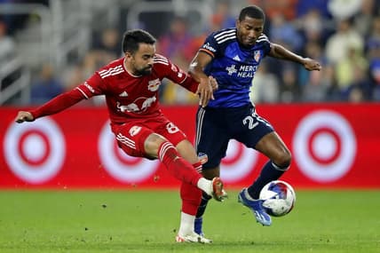 Oct 29, 2023; Cincinnati, OH, USA; New York Red Bulls midfielder Luquinhas (82) battles for the ball against FC Cincinnati defender Ray Gaddis (28) during the first half of game one in a round one match of the 2023 MLS Cup Playoffs at TQL Stadium. Mandatory Credit: Katie Stratman-USA TODAY Sports