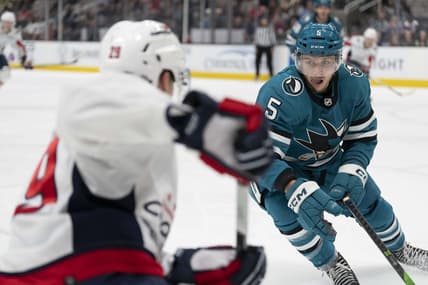 Nov 27, 2023; San Jose, California, USA; San Jose Sharks defenseman Matt Benning (5) defends against Washington Capitals center Hendrix Lapierre (29) during the third period at SAP Center at San Jose. Mandatory Credit: Neville E. Guard-USA TODAY Sports