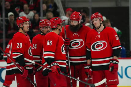 Nov 26, 2023; Raleigh, North Carolina, USA;  Carolina Hurricanes center Sebastian Aho (20) center Seth Jarvis (24) left wing Teuvo Teravainen (86) defenseman Brent Burns (8) and right wing Andrei Svechnikov (37) talk against the Columbus Blue Jackets during the third period at PNC Arena. Mandatory Credit: James Guillory-USA TODAY Sports